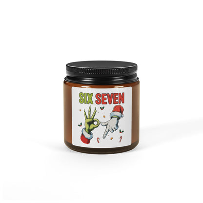 Candle with a decorative label featuring Christmas cartoon hands and 'Six Seven' text on a white background