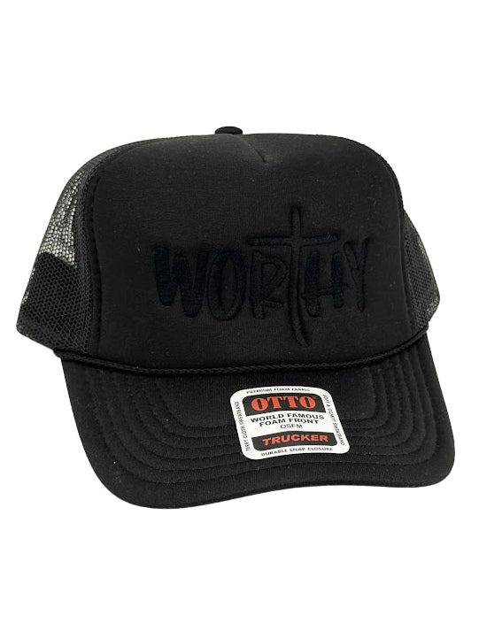 Black trucker hat with 'Worthy' branding on a white background