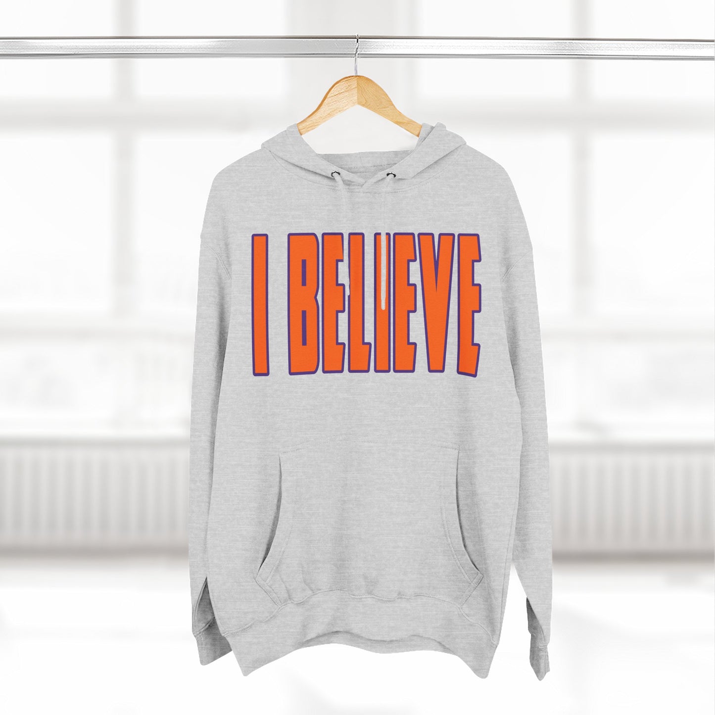 Hoodie in Clemson colors with 'I BELIEVE' text in a white background
