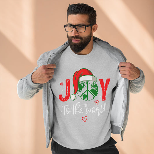 Man wearing a gray sweatshirt with a Christmas design and text on a beige background