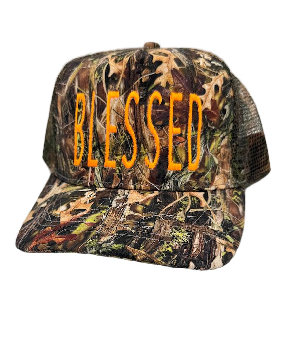 Camouflage cap with 'BLESSED' text on a white background