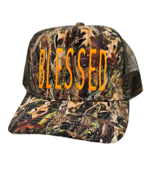 Camouflage cap with 'BLESSED' text on a white background